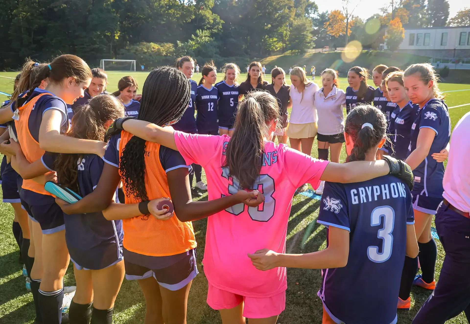 Students doing a team huddle