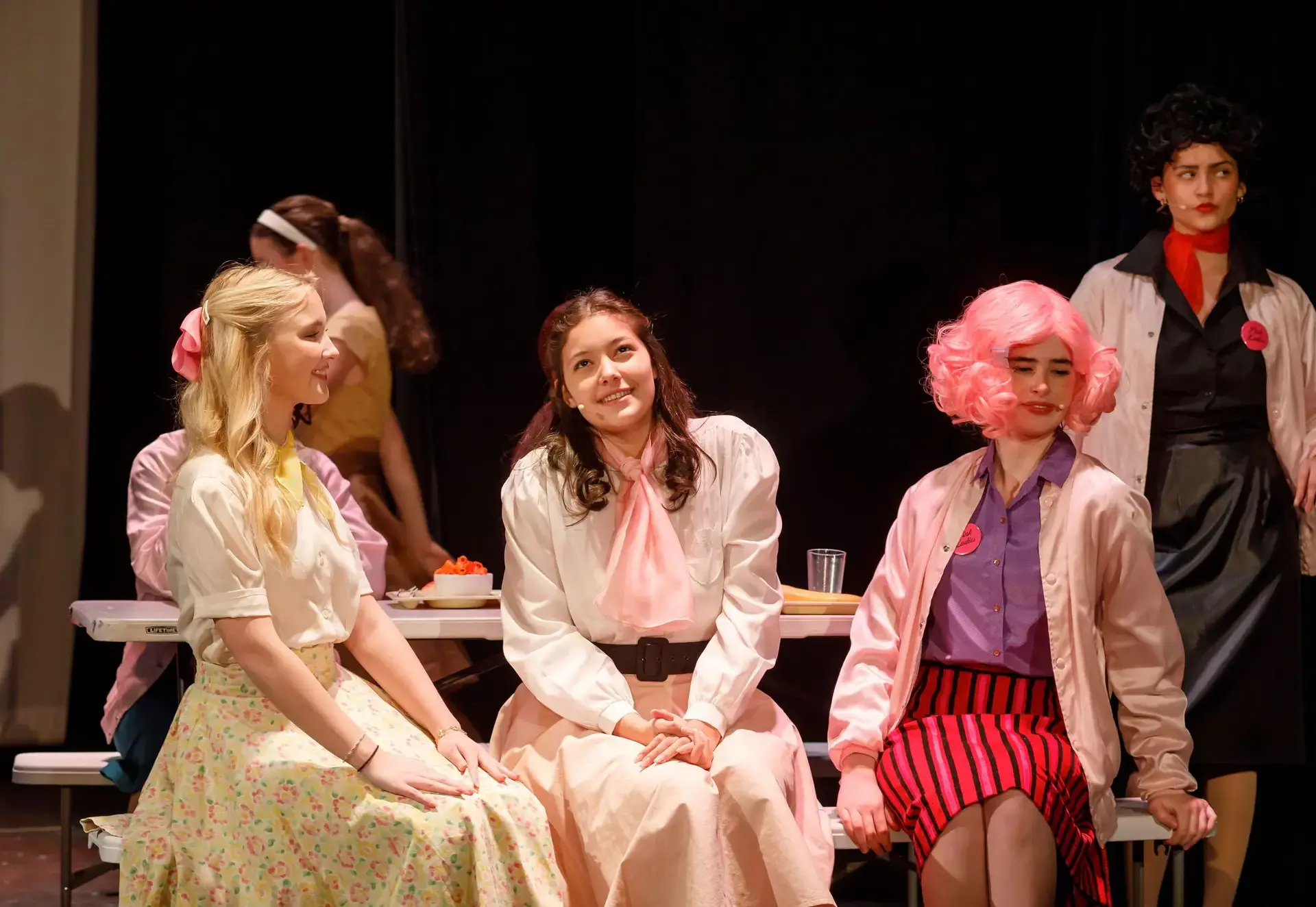 Students performing on stage