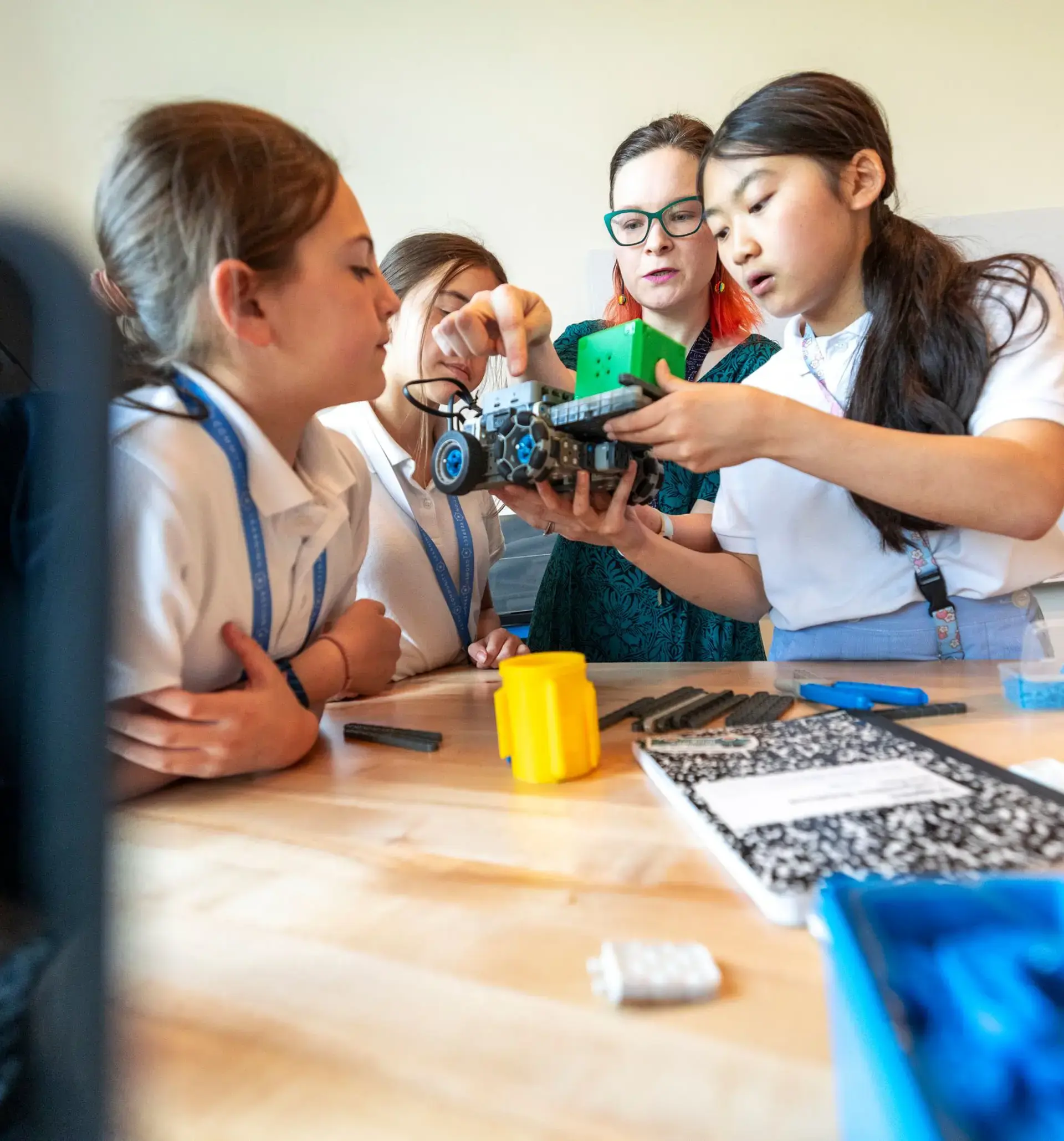 Middle School students program, code and build robots.