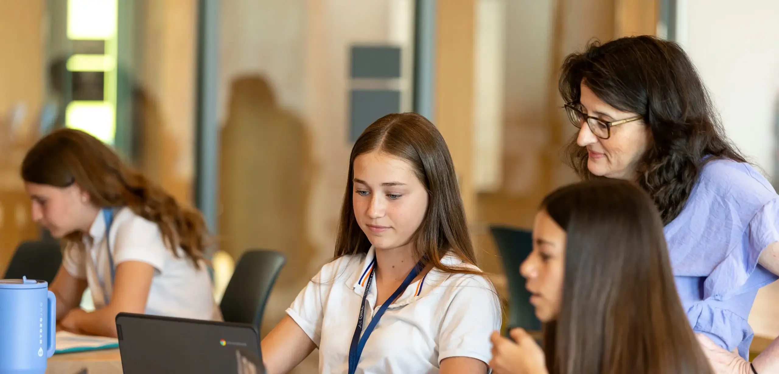Student asking a question about a classroom activity to the teacher