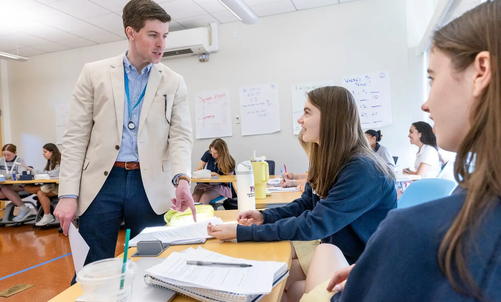 Teacher explaining lesson to a student